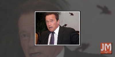 Arnold Schwarzenegger works out with pet donkey