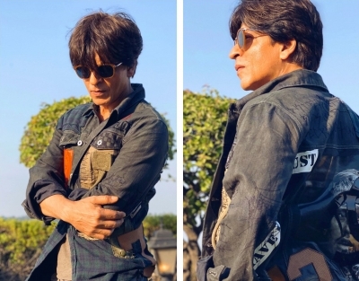 Superstar Shah Rukh Khan is inspired by the fashion sense of his close friend and filmmaker Karan Johar, and says he is trying to match up to it.