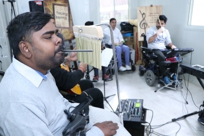Chandigarh: Ajeya Raj, 28, playing chimes at Chandigarh Spinal Rehab, Sector 28 on Nov 21, 2019. (Photo: IANS)