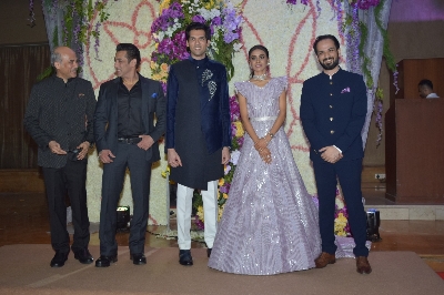Mumbai: Filmmaker Sooraj Barjatya and actors Salman Khan and Madhuri Dixit with the newly weds Devaansh Barjatya (Sooraj Barjatya's son) and Nandini (Barjatya's daughter-in-law) at their wedding reception in Mumbai on Nov 29, 2019. (Photo: IANS)