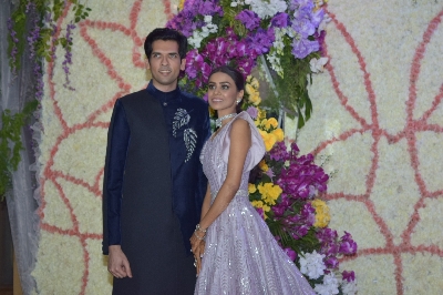 Mumbai: Filmmaker Sooraj Barjatya's son Devaansh Barjatya and his wife Nandini at their wedding reception in Mumbai on Nov 29, 2019. (Photo: IANS)